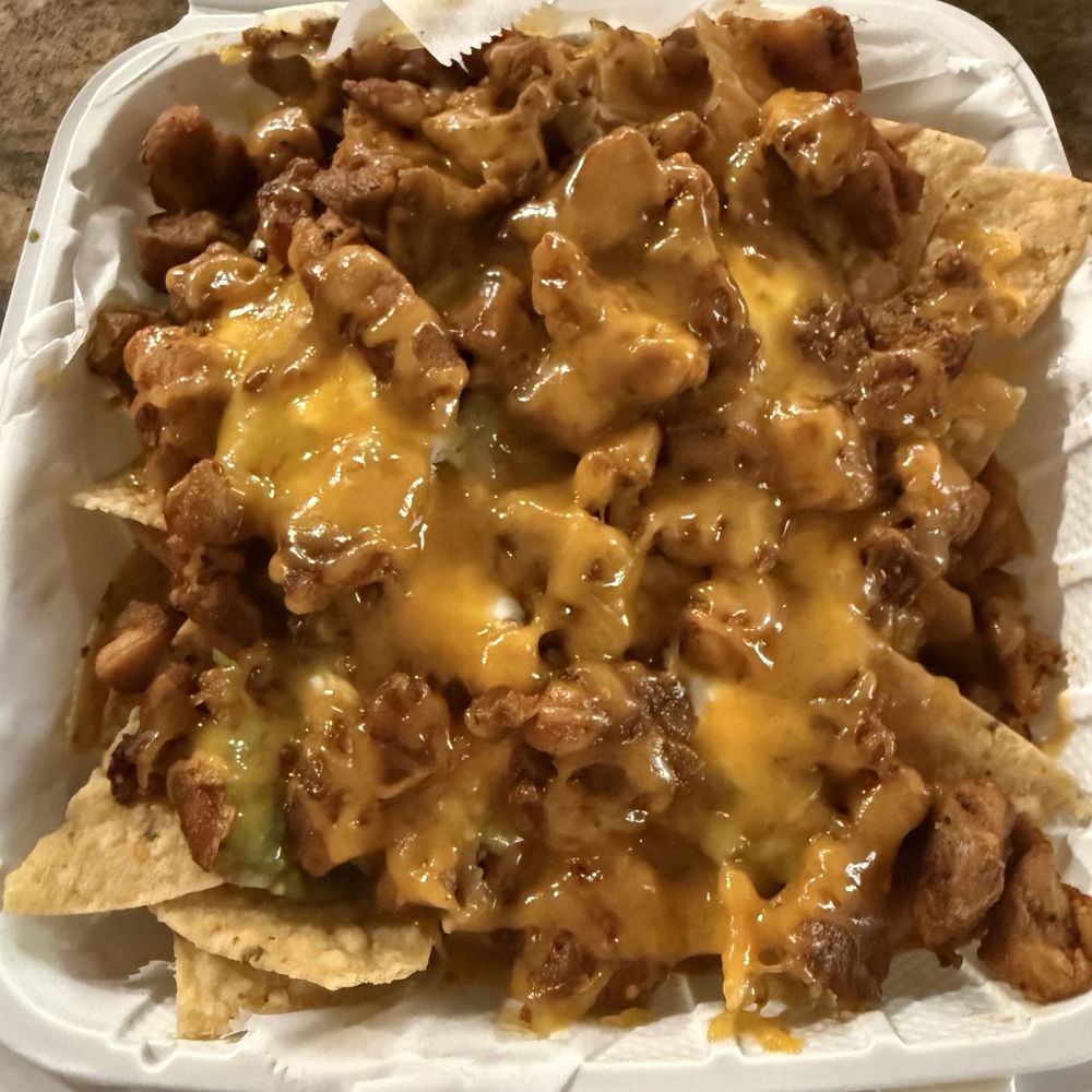Chicken asado nachos. Why use AI pictures on the menu when the food looks this good? Chicken asado nachos. Why use AI pictures on the menu when the food looks this good?