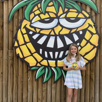 Pineapple Willy's - The little one enjoying her trinket from Pineapple Willie's. - Seafood Near Me - Panama City Beach, Florida