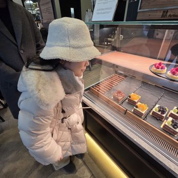 BA Bakehouse - Well-dressed little customer with an excited smile. - Bakeries Near Me - Bellevue, Washington