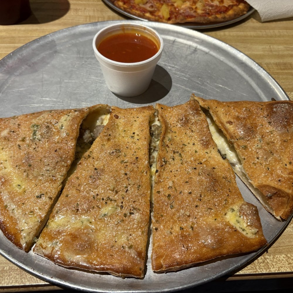 5th Street Pizza - Italian sausage and mushroom calzone. - Pizza Near Me - Allen, Texas 5th Street Pizza - Italian sausage and mushroom calzone. - Pizza Near Me - Allen, Texas