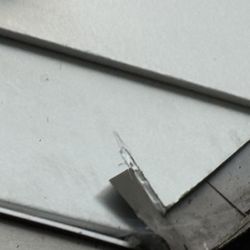 Krech Exteriors - This is a corner in our roof system. I asked why metal is protruding out - the grey stuff to the left. He said it's the required way. No!