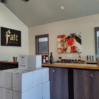 Fate Wines - a bar with boxes stacked on top of it - Wine Tasting Room Near Me - Plymouth, California