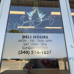 Sandy Sweetz - Storefront Door with Hours