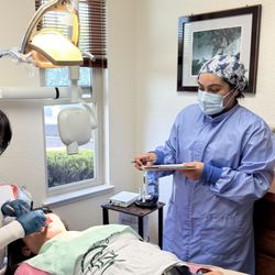 Dr. Ritu Bhardwaj DDS - Dr. Ritu and her caring staff with a patient.