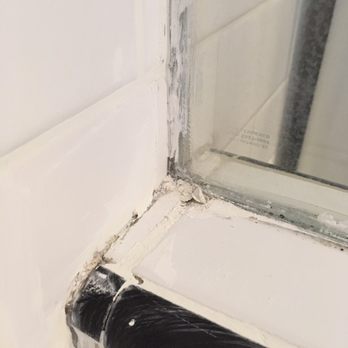 Amador General Construction - Smeared white grout with clear silicone cauliking - Handyman Near Me