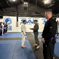 Strike and Submit Martial Arts and Fitness - Member of SAS getting recognized for his progression. AKA promotion.