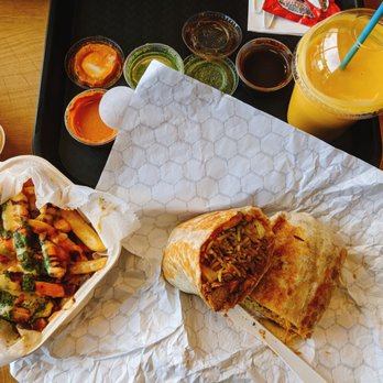 Maast Indian - Butter chicken burrito, smothered fries, assorted chutneys, mango lassi - Indian Near Me - Irvine, California