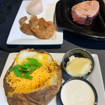 Black Rock Bar & Grill - Loaded Baked Potato (front); 6oz Sirloin, Shrimps and Scallop from Tour of Black Rock combo (back) - Bars Near Me - Beavercreek, Ohio