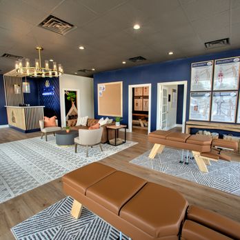 Ignite Chiropractic - Our community seating area is a place for our practice members to relax and connect before or after their adjustments. - Chiropractors Near Me - Cypress, Texas Ignite Chiropractic - Our community seating area is a place for our practice members to relax and connect before or after their adjustments. - Chiropractors Near Me - Cypress, Texas