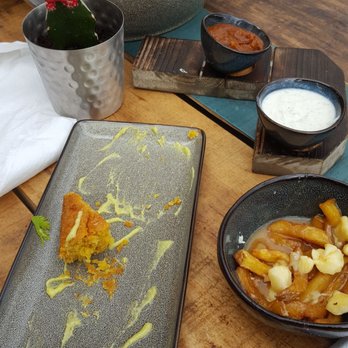 Joe Bird - Small poutine and smaller corn bread on giant plate. How about giant cornbread and small plate lol - Chicken Shop Near Me - Toronto, Ontario