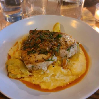 A Tavola - Swordfish and creamy polenta with roasted veg harissa vinaigrette - Italian Near Me - Winchester, Massachusetts A Tavola - Swordfish and creamy polenta with roasted veg harissa vinaigrette - Italian Near Me - Winchester, Massachusetts