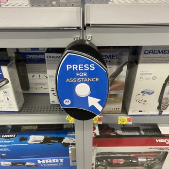 Walmart Supercenter - It doesn't work. - A blue and black assistance button with a white arrow and text 'PRESS FOR ASSISTANCE' is attached to a metal shelf in a retail store. - Grocery Near Me - Albuquerque, New Mexico