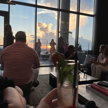 AC Sky Bar - sunshine cooler cocktail and view from inside seating - Bars Near Me - Orlando, Florida AC Sky Bar - sunshine cooler cocktail and view from inside seating - Bars Near Me - Orlando, Florida