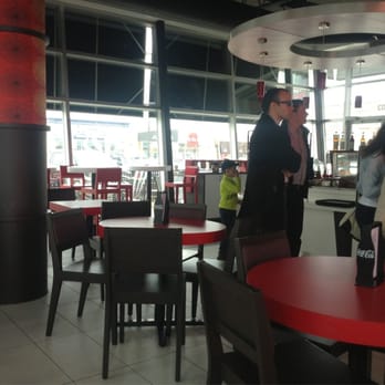 Presse Cafe - a man and a woman talking - Cafes Near Me - Montreal, Quebec