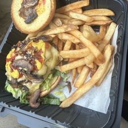 Smash burger w/ ketchup, mustard, grilled mushrooms, and cheese Smash burger w/ ketchup, mustard, grilled mushrooms, and cheese