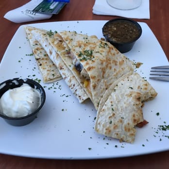 12th Fairway - a plate of quesadillas with sour cream - New American Near Me - El Paso, Texas 12th Fairway - a plate of quesadillas with sour cream - New American Near Me - El Paso, Texas