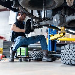 Seymour's Garage - Dedicated mechanic working on a vehicle, showcasing our commitment to thorough and precise auto repairs.