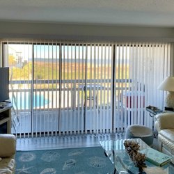 Budget Blinds of Hilton Head Island - Vertical blinds are the perfect solution for expansive oceanfront windows in Hilton Head Island, while offering effortless light control.