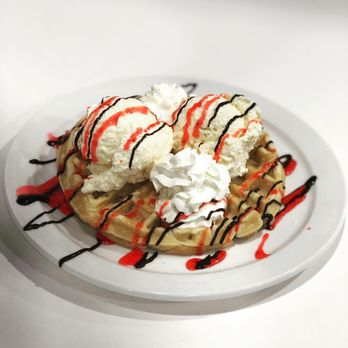 Halibut House Fish&Chips Kingston - a waffle topped with whipped cream and drizzle - Fish & Chips Near Me - Kingston, Ontario Halibut House Fish&Chips Kingston - a waffle topped with whipped cream and drizzle - Fish & Chips Near Me - Kingston, Ontario