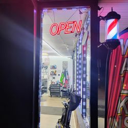 D'Friends Barber Shop - Why propped the door open, blast that shit music, and have the open sign lit up if you didn't want anyone to come in..? Don't gotta be ride