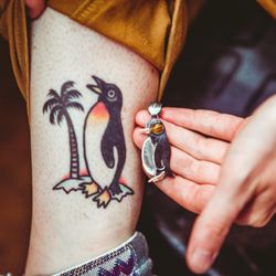 Boulder Metalsmithing Association - Student shows off the penguin they made in our pendant making workshop!