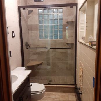 Charles Weiss Contracting - a bathroom with a shower and toilet - General Contractors Near Me