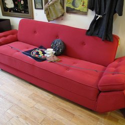 The Scarlet Willow - Red sleeper sofa.