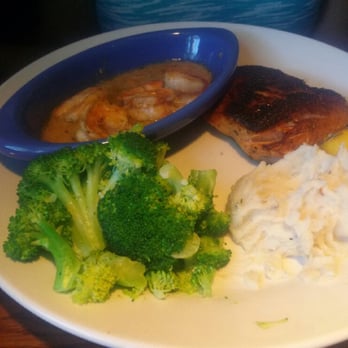 Red Lobster - Salmon dish with side of garlic mashed potatoes and broccoli. I had my topping of cajun shrimp on the side. - Seafood Near Me - Webster, Texas Red Lobster - Salmon dish with side of garlic mashed potatoes and broccoli. I had my topping of cajun shrimp on the side. - Seafood Near Me - Webster, Texas