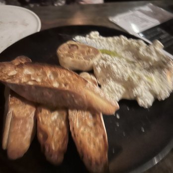Branca - Fresh ricotta and perfectly toasted baguette with roasted garlic and a hint of lemon - Cocktail Bars Near Me - Pittsford, New York Branca - Fresh ricotta and perfectly toasted baguette with roasted garlic and a hint of lemon - Cocktail Bars Near Me - Pittsford, New York