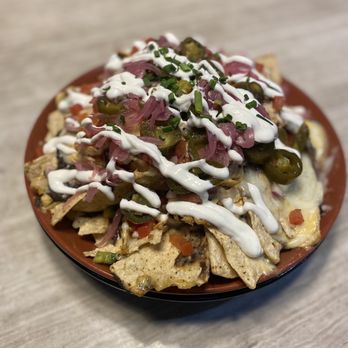 Mill's Modern Social - a plate of nachos - Wine Bars Near Me - Tempe, Arizona