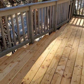 Anderson Construction Services - a wooden deck with railings - General Contractors Near Me Anderson Construction Services - a wooden deck with railings - General Contractors Near Me
