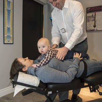 Somerset Family Chiropractic - Dr. Brennan treating a young patient. - Chiropractors Near Me - Ajax, Ontario Somerset Family Chiropractic - Dr. Brennan treating a young patient. - Chiropractors Near Me - Ajax, Ontario