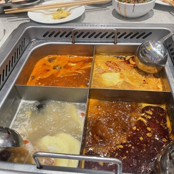 Haidilao Hotpot Katy - Tomato base(LUQ), mushroom soup base(LLQ), classic spicy base(RLQ), and Tom yum base(RUQ) - Seafood Near Me - Katy, Texas Haidilao Hotpot Katy - Tomato base(LUQ), mushroom soup base(LLQ), classic spicy base(RLQ), and Tom yum base(RUQ) - Seafood Near Me - Katy, Texas