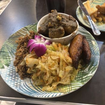 Queen Trini Lisa - Curry goat, rice and peas, cabbage, and sweet plantains. - Trinidadian Near Me - New Orleans, Louisiana Queen Trini Lisa - Curry goat, rice and peas, cabbage, and sweet plantains. - Trinidadian Near Me - New Orleans, Louisiana