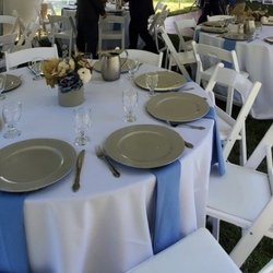Great Lakes Tent - Round tables and white padded chairs. The white padded chairs are $1 more than regular white chairs but they look higher class