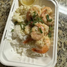 shrimp and rice in a styrofoam container shrimp and rice in a styrofoam container