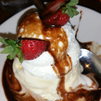 Outback Steakhouse - Spotted Dog Sundae with strawberries on top... - Steakhouses Near Me - Secaucus, New Jersey