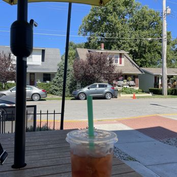 Fresco Tea Bar - My Sugar Free Pomegranate Oolong Iced Tea on a patio table facing the houses across the street - Bubble Tea Near Me - Jeffersonville, Indiana Fresco Tea Bar - My Sugar Free Pomegranate Oolong Iced Tea on a patio table facing the houses across the street - Bubble Tea Near Me - Jeffersonville, Indiana