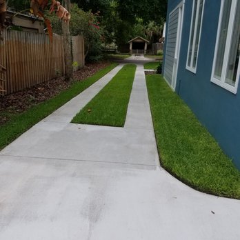 Freeman's All Purpose Services LLC - a concrete walkway with grass - Landscaping Near Me Freeman's All Purpose Services LLC - a concrete walkway with grass - Landscaping Near Me