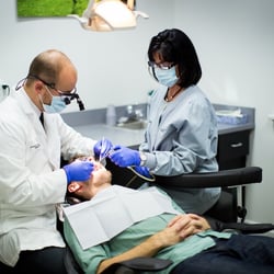 Moorehead Dentistry - Dr. Moorehead performing a dental procedure. Moorehead Family Dentistry, your Blue Ash Dentist