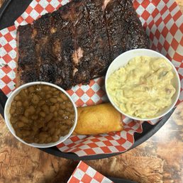 Half rack St Louis ribs dinner, baked beans, potato salad, & corn bread. Half rack St Louis ribs dinner, baked beans, potato salad, & corn bread.