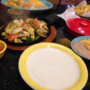 Los Jalapenos - My steaming Veggie Fajitas with the regular fixings:corn tortillas,refried beans,pico de gallo,sour cream,spanish rice, & cheese - Tex-Mex Near Me - Carrollton, Texas
