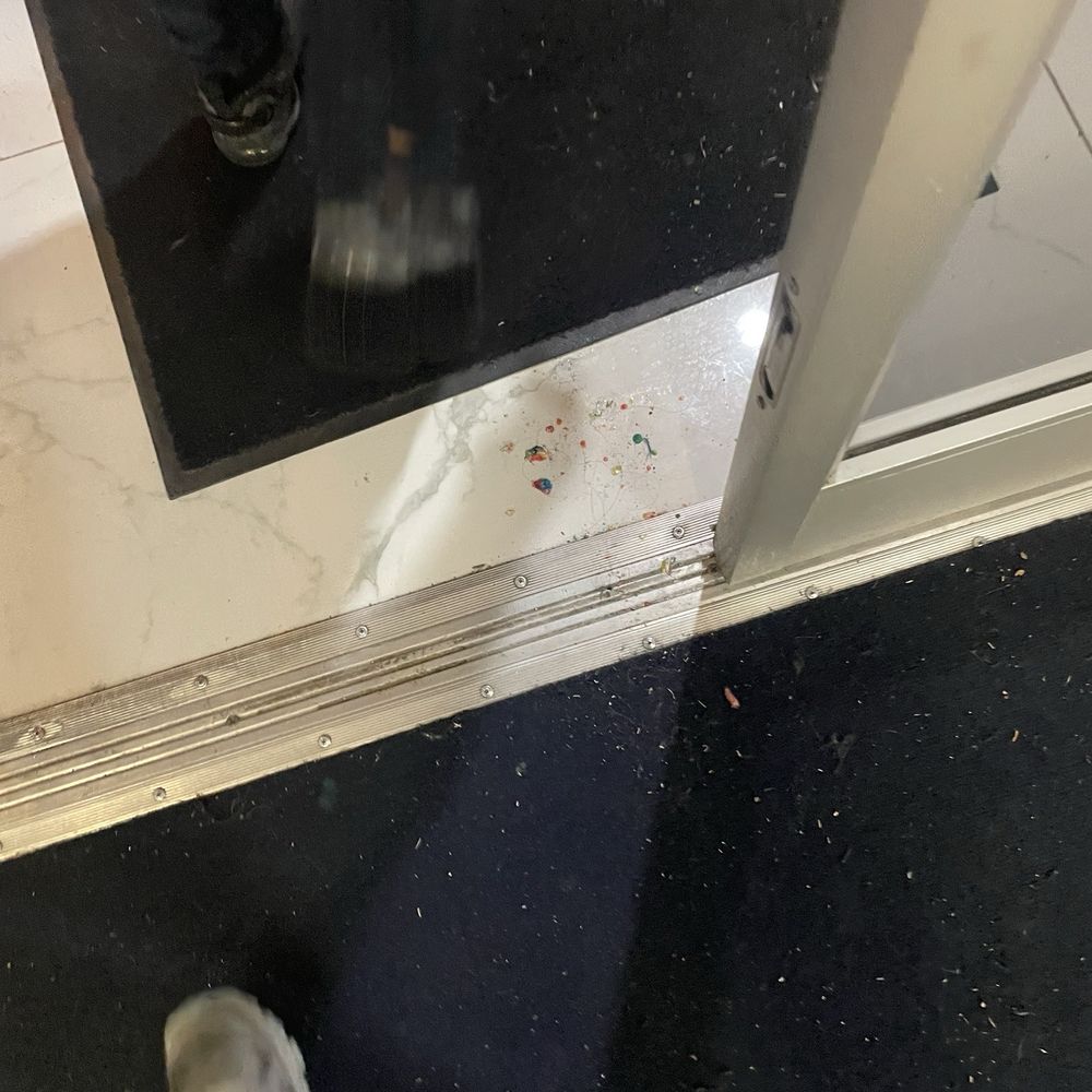 901 Bowl - What looks like stuck on candy or some kind of food left on the floor, not clean - Bowling Near Me - Collierville, Tennessee