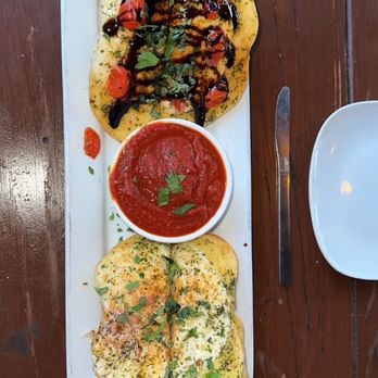 Tony Rigatoni's Italian Kitchen - Garlic cheese bread - half with roasted tomatoes, basil & balsamic glaze - Italian Near Me - Morrison, Colorado Tony Rigatoni's Italian Kitchen - Garlic cheese bread - half with roasted tomatoes, basil & balsamic glaze - Italian Near Me - Morrison, Colorado