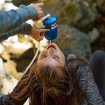 Bay Area Expeditions - Testing out one of their water filters in the stream. - Tours Near Me Bay Area Expeditions - Testing out one of their water filters in the stream. - Tours Near Me