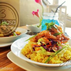 Café Basa - Asian-glazed calamare with turmeric rice Crispy fried calamare glazed with honey sweetened sauce that is infused with a unique blend of spic