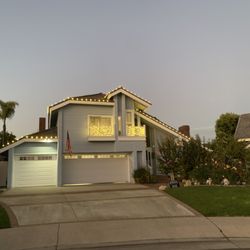 Shine Bright OC - Warm white display - roofline + balcony wraps.