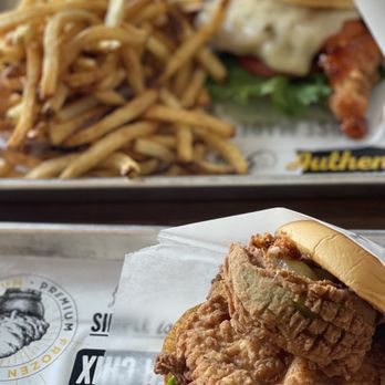 Super Chix - Hot Honey sandwich in back and stuffed avocado with chicken filet sandwich in front - Sandwiches Near Me - Williamsburg, Virginia Super Chix - Hot Honey sandwich in back and stuffed avocado with chicken filet sandwich in front - Sandwiches Near Me - Williamsburg, Virginia