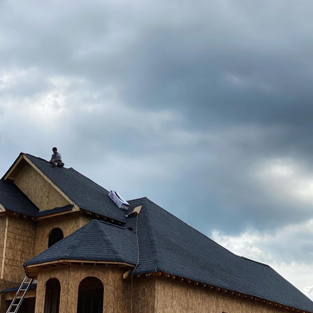 Slide of Rico’s Roofing Restorations