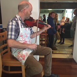 Camp Street Cafe owner Dessie playing a tune for us